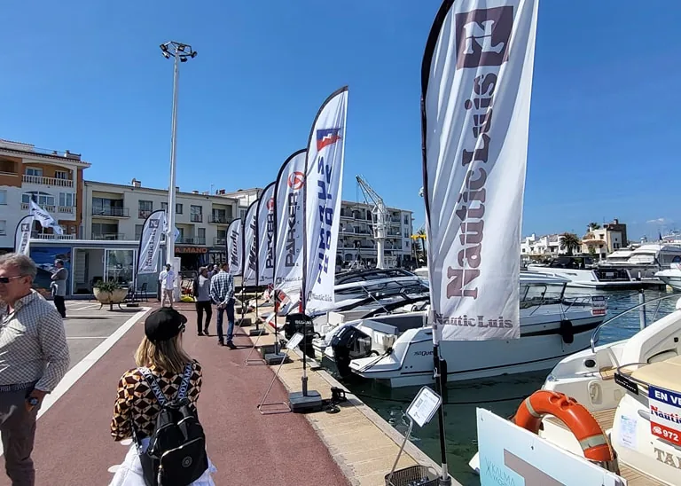 Nautic Luis at the 2024 Used Boat Fair, exterior view of the dock with boats and banners.