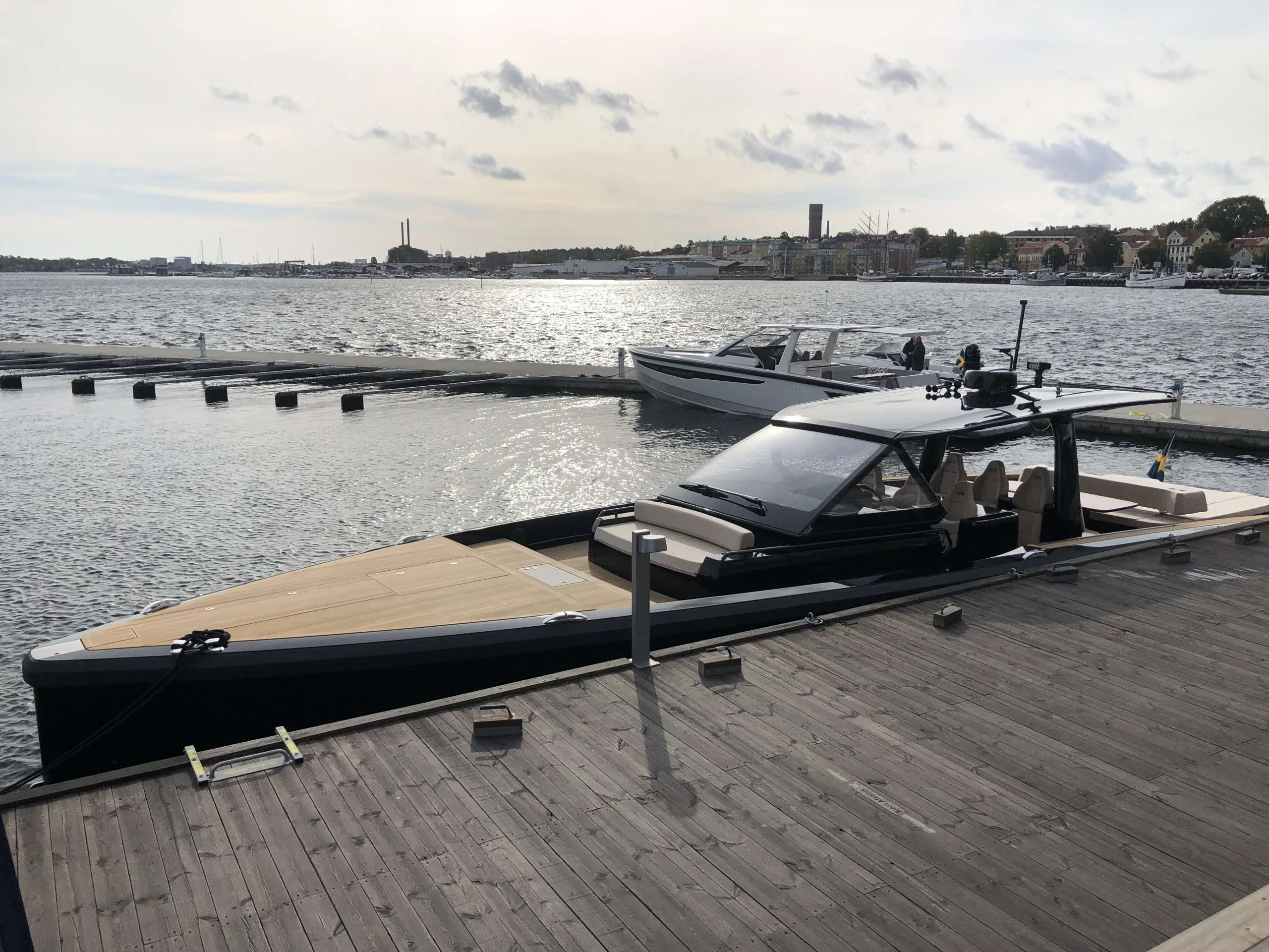 Windy SR 60 moored at a dock, exterior side view, with foredeck, cabin and aft area.