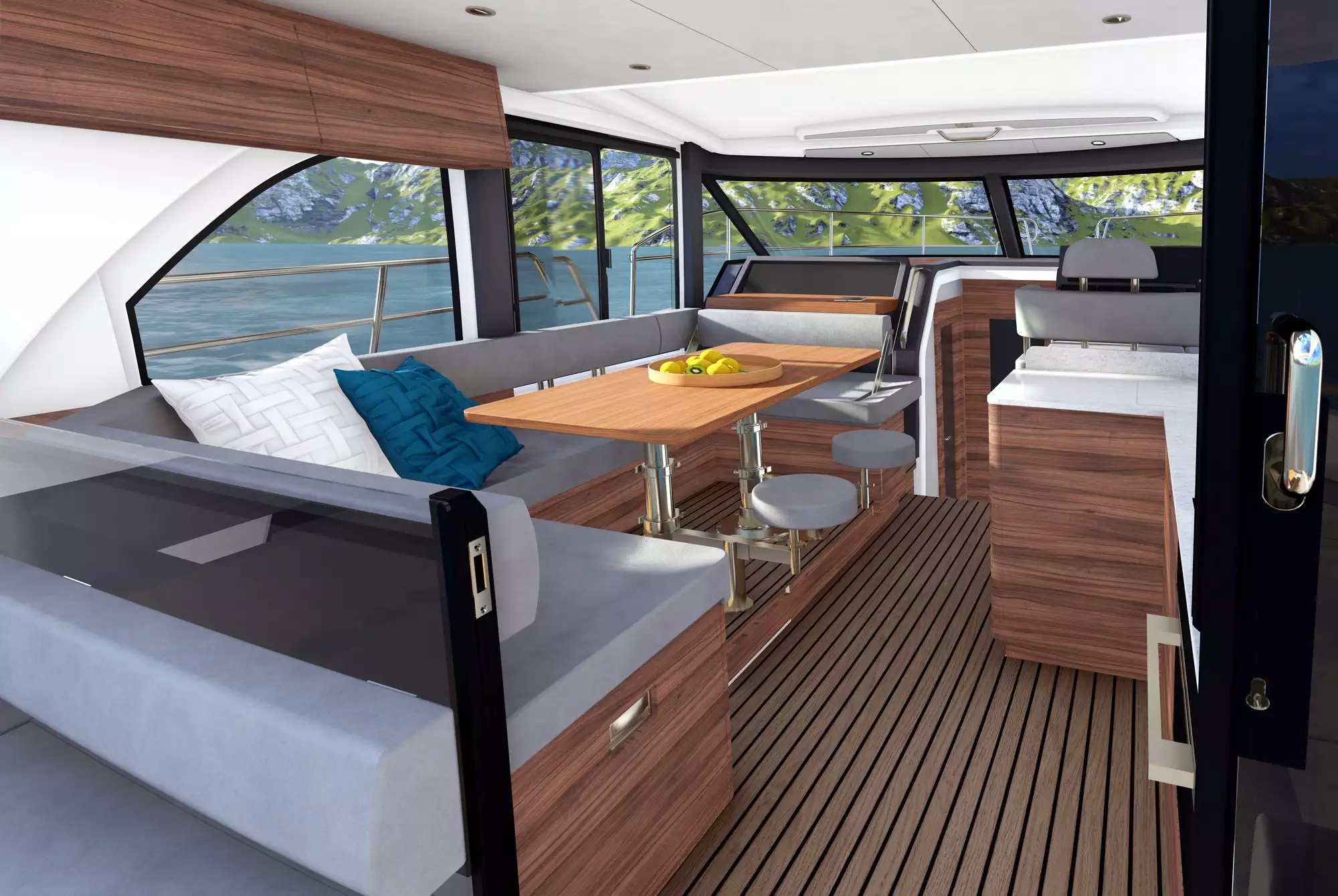 Interior of the Marex 440 Scandinavia viewed from the entrance, with lounge, table, galley and windows.