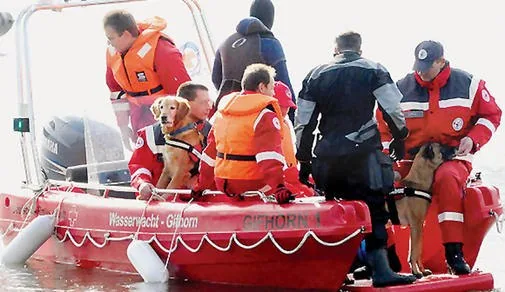 1a1 PIONER MULTI III, exterior side view with rescue equipment, dogs and people on board by the water