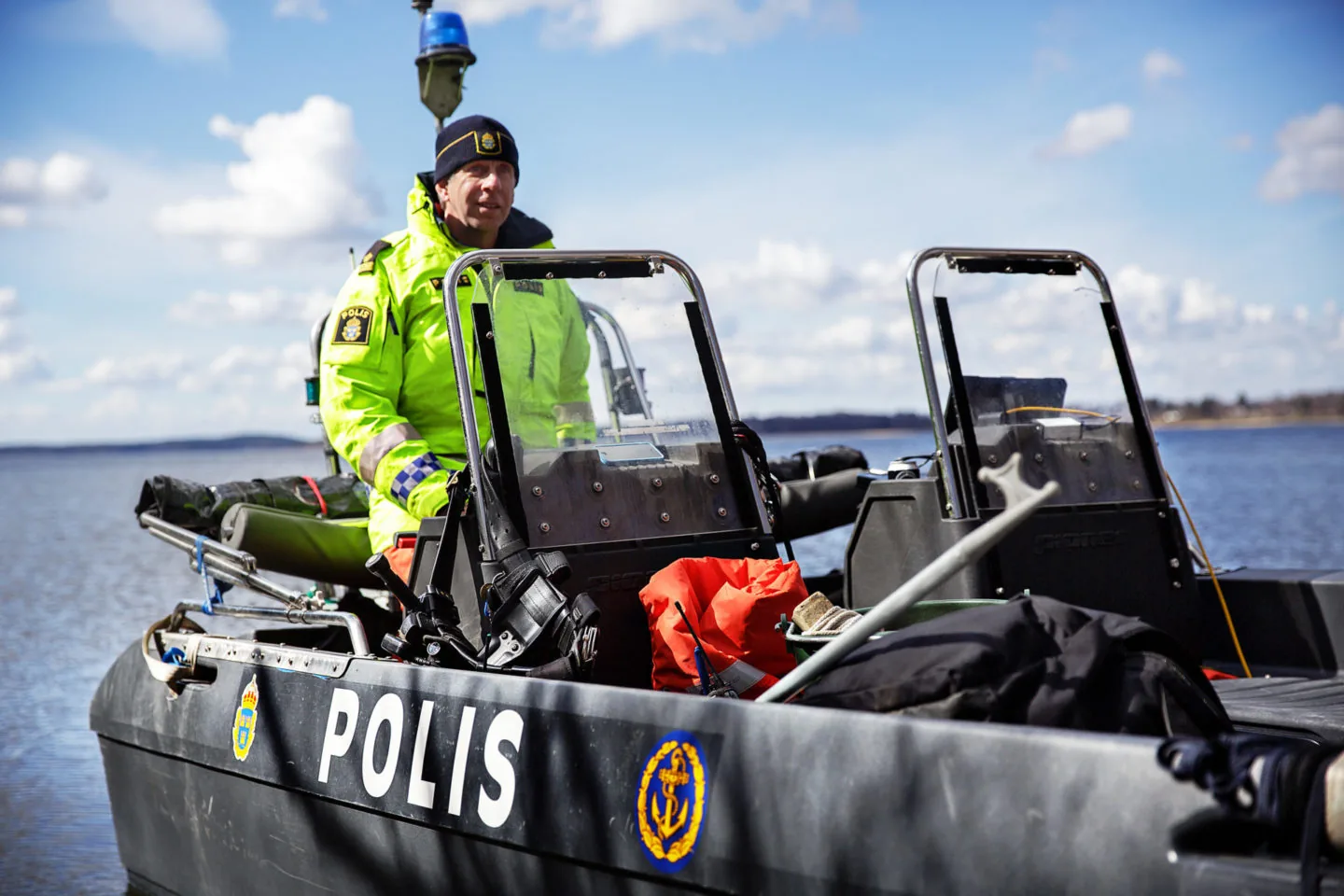 PIONER MULTI III in exterior side view, with two windshields, police equipment and an officer on board.