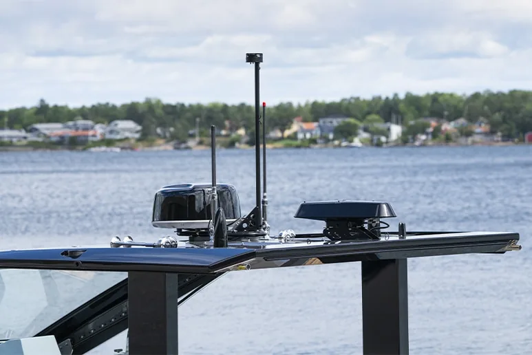 Windy SR52 Blackbird, side view of the exterior deck with windshield, antennas and nautical equipment.