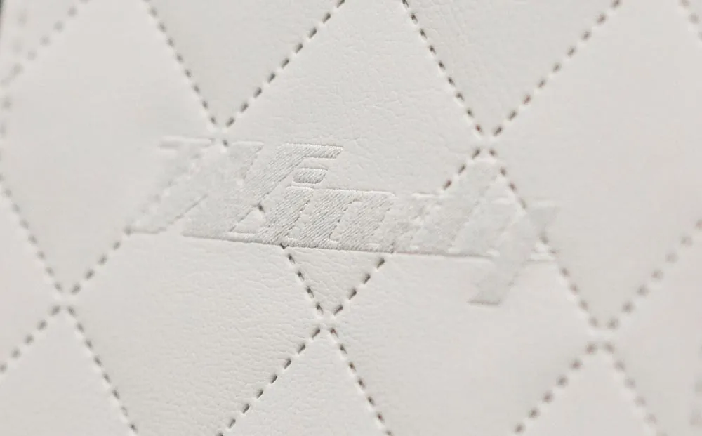 Detail of the white padded upholstery of the Windy 32 Grand Zonda with embroidered logo.
