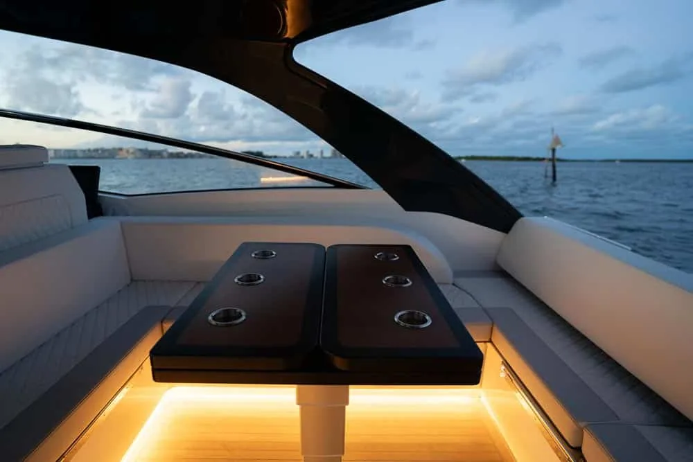 Windy Boat Cockpit table of the Windy 40 Camira RS with LED lights on at dusk