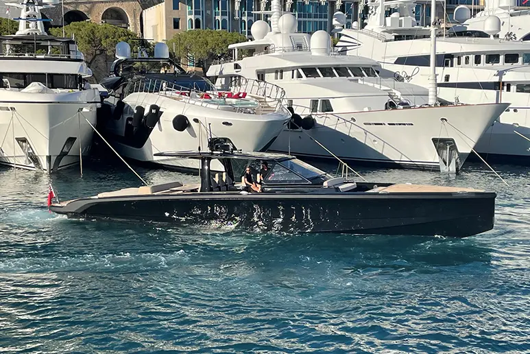 Windy SR60 in the water in front of megayachts